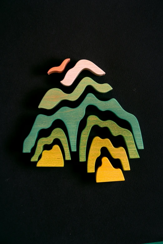 a wooden mountain with a bird sitting on top of it, inspired by Eyvind Earle, multicoloured, multiplayer set-piece, black fir, caves