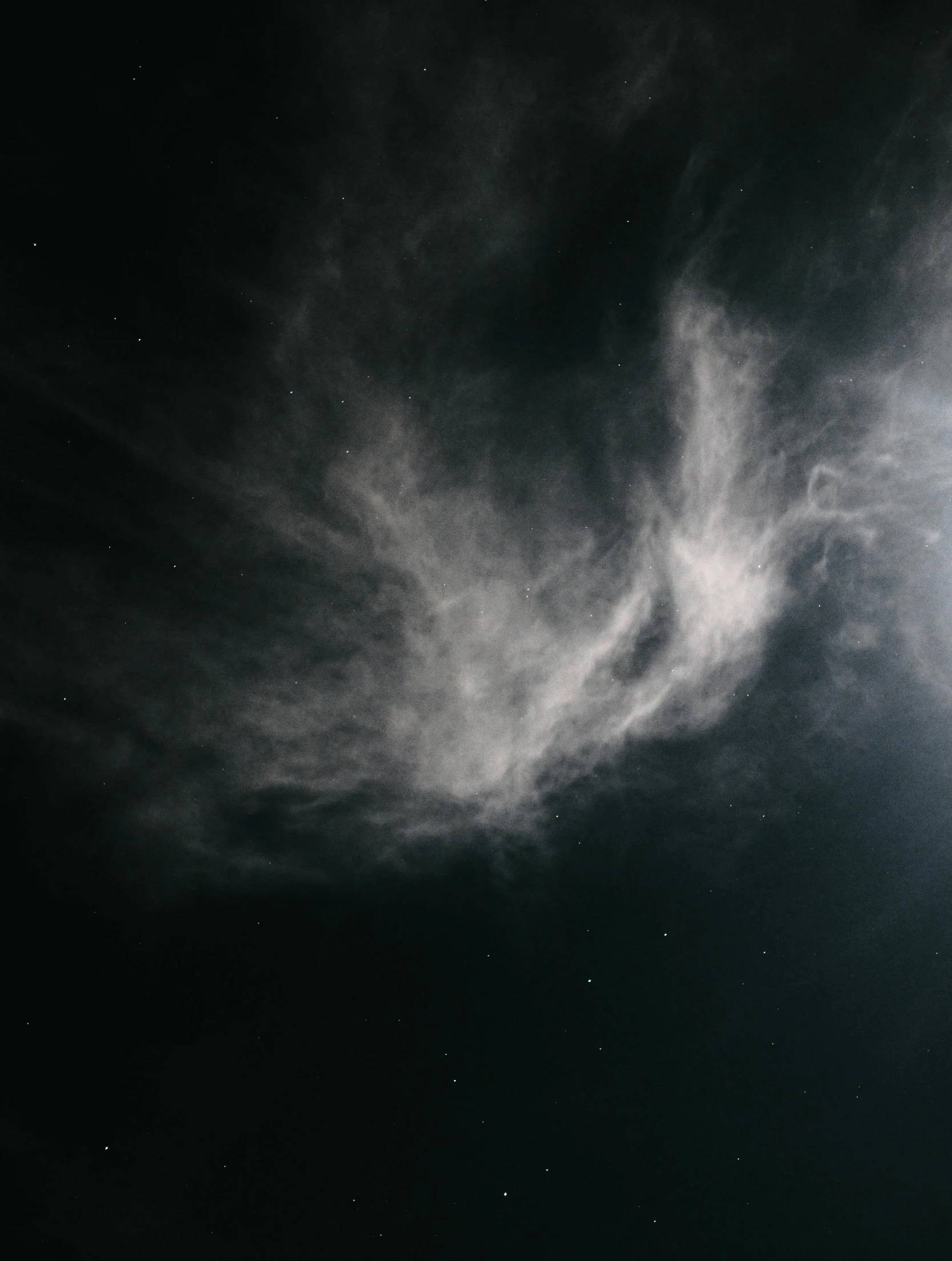 the moon is shown from below of some clouds