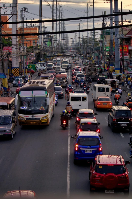 traffic on a busy street with many different vehicles