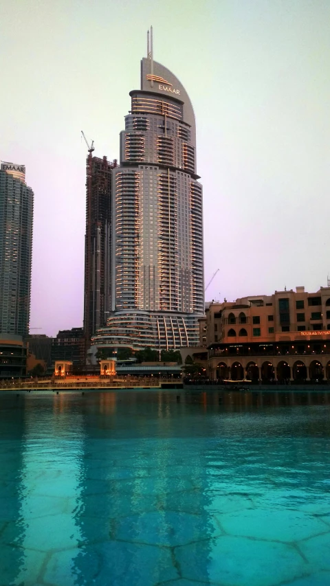 a large body of water with tall buildings on the side