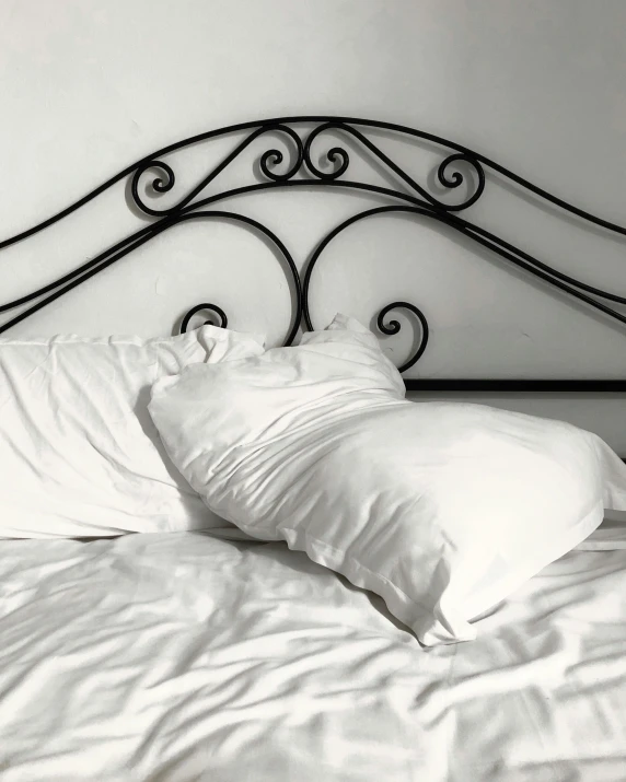 an unmade bed is in a black and white po