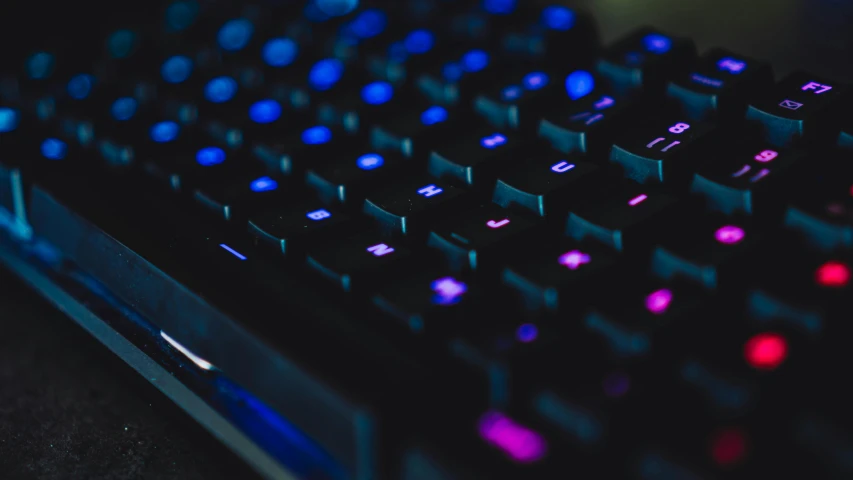 a computer keyboard sitting on top of a desk, by Adam Marczyński, trending on pexels, computer art, purple glowing core in armor, colourful close up shot, video game texture, profile picture 1024px