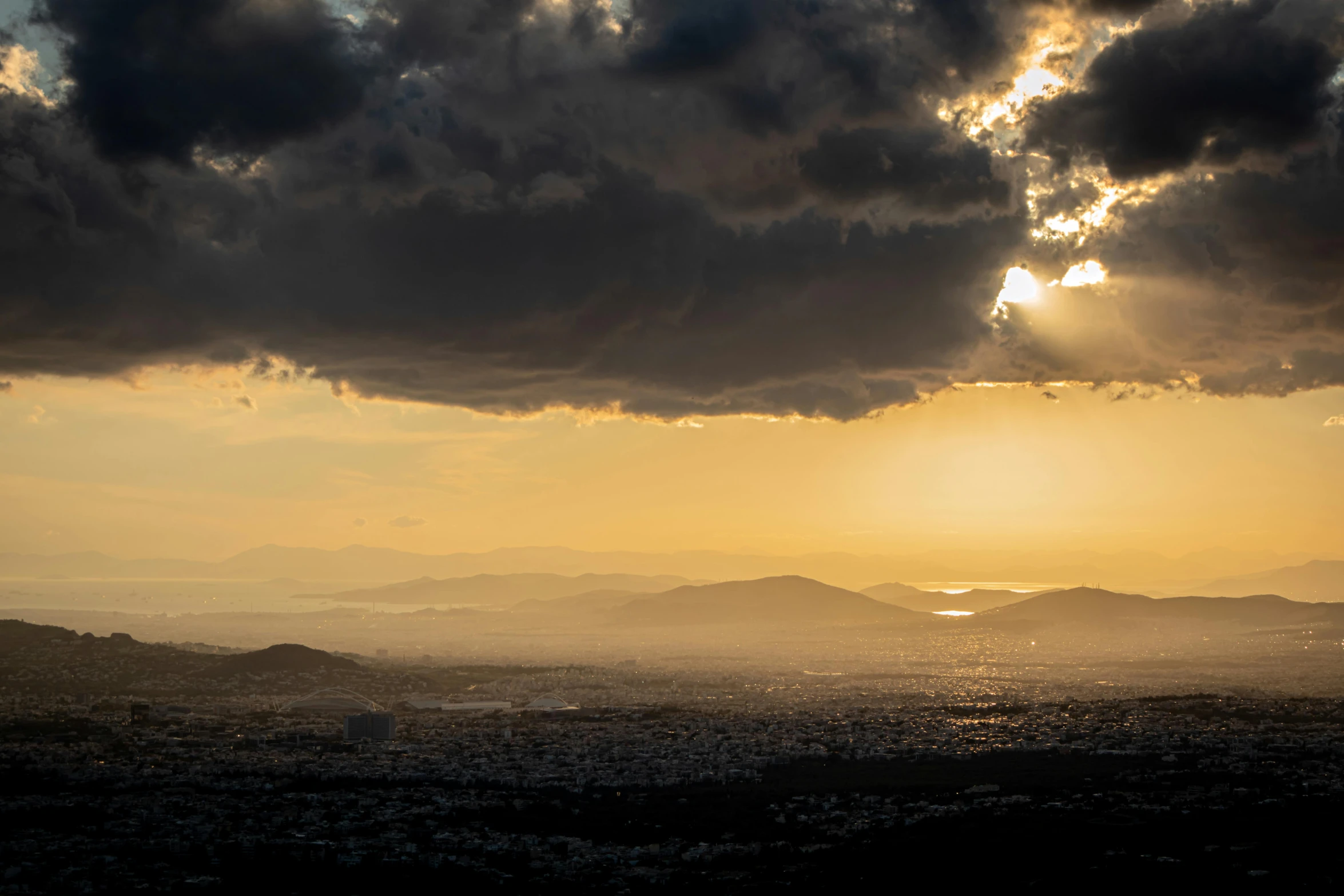 a scenic sunset over the hills with a bird on it