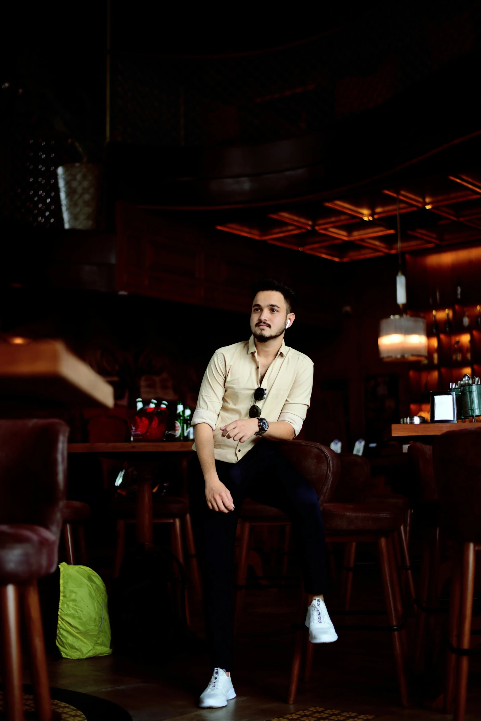 a man sitting on a stool in a bar, a portrait, inspired by Nabil Kanso, pexels contest winner, justin sun, full body image, instagram picture, profile picture 1024px