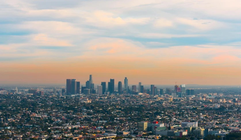 a view of a city from the top of a hill, an album cover, inspired by L. A. Ring, unsplash contest winner, koyaanisqatsi, background image, !dream los angeles, hazy