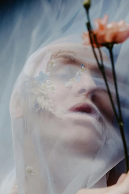 a person's face with flowers in between them