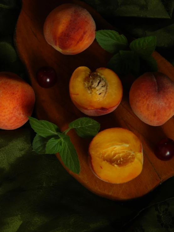 a wooden plate topped with sliced peaches and cherries, trending on unsplash, renaissance, ((still life))