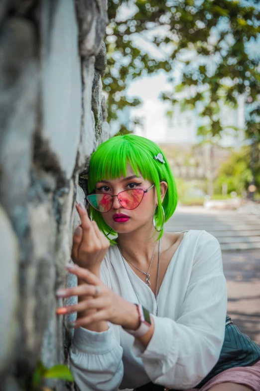 a woman with green hair is leaning against a wall, trending on pexels, young asian woman, colorful]”, summer season, low iso