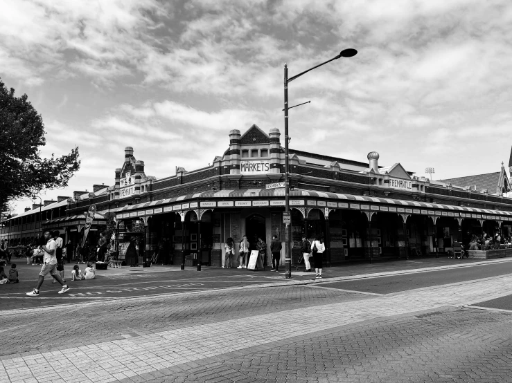 a black and white po of people on the side of a street