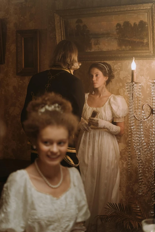 a couple of people that are standing in front of a mirror, a picture, inspired by Thomas Stothard, pexels, rococo, perfectly lit. movie still, festive atmosphere, dusty lighting, napoleonic wars