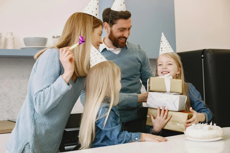 a family celebrating a birthday with a cake and presents, pexels contest winner, private press, wearing a grey wizard hat, profile image, customers, lachlan bailey