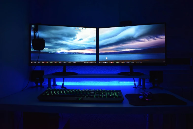 a couple of monitors sitting on top of a desk, by Dan Content, unsplash, computer art, high blue lights, 2 5 6 x 2 5 6 pixels, ultra wide horizon, reddit post