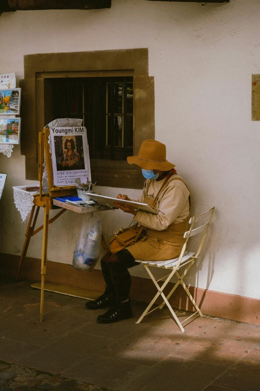 a man sitting on a chair in front of a building, a fine art painting, inspired by Francesco Hayez, pexels contest winner, caracter with brown hat, people at work, masked person in corner, old woman