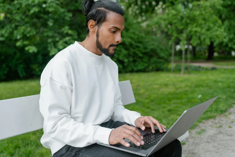 a man sitting on a bench using a laptop computer, pexels contest winner, realism, white sleeves, sydney park, official screenshot, mixed race