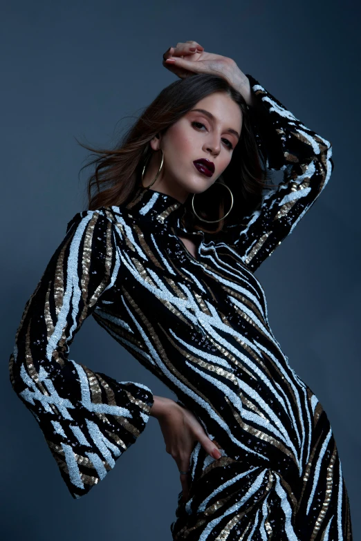 a woman posing in a black and white dress, sequin top, asher duran, blue silver and black, midnight