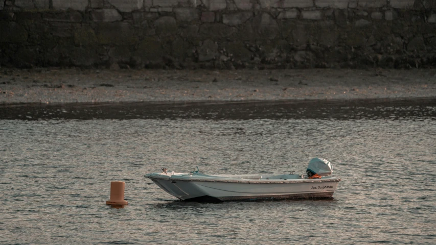 a small boat floating on top of a body of water, by Elsa Bleda, shin hanga, at the seaside, inlets, mina petrovic, evenly lit