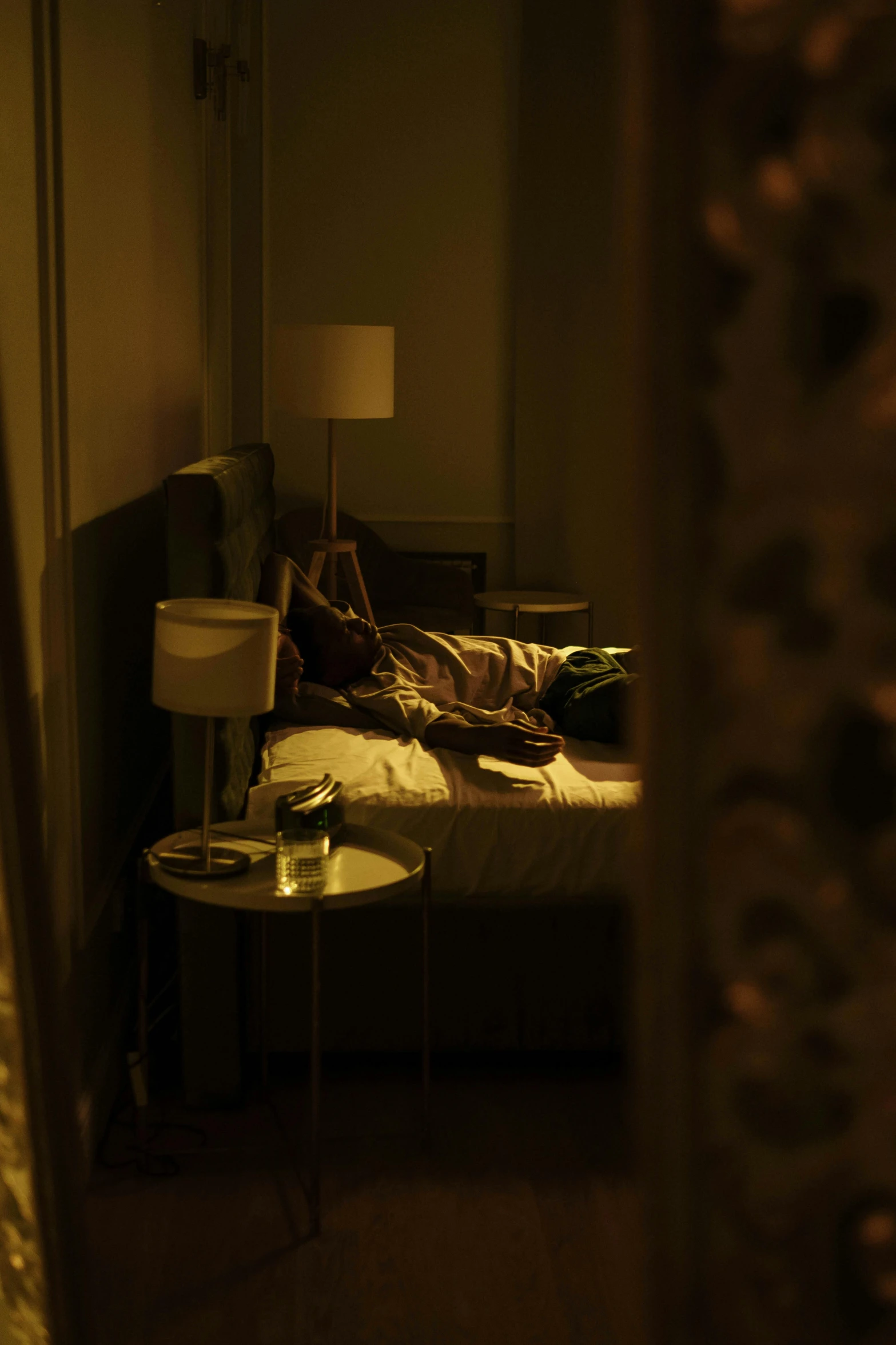 the image shows a man sleeping on his bed