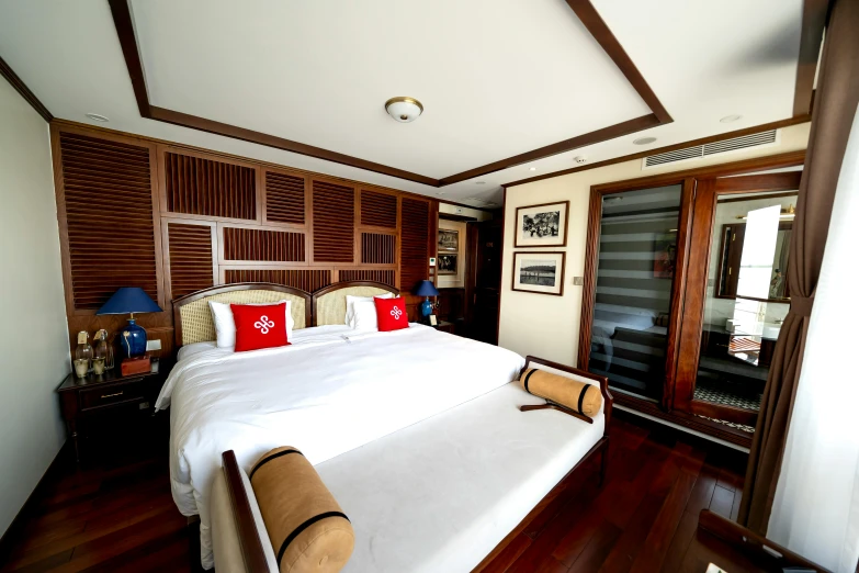 the bed in the room is made of white sheets and wood