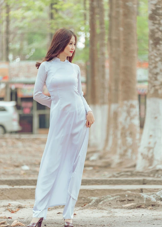 a woman in a white dress posing for a picture, inspired by Ruth Jên, happening, ao dai, 5 0 0 px models, pale blue outfit, square