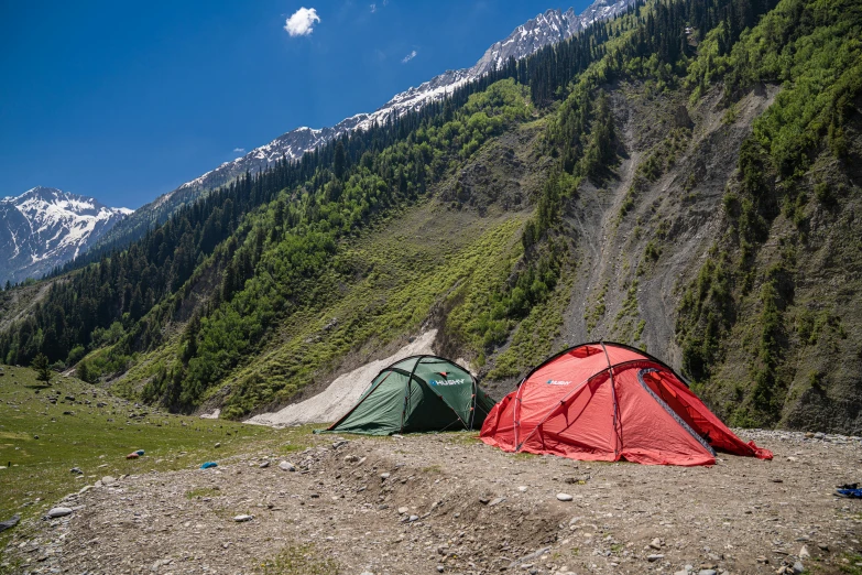 a couple of tents sitting on top of a dirt field, by Muggur, profile image