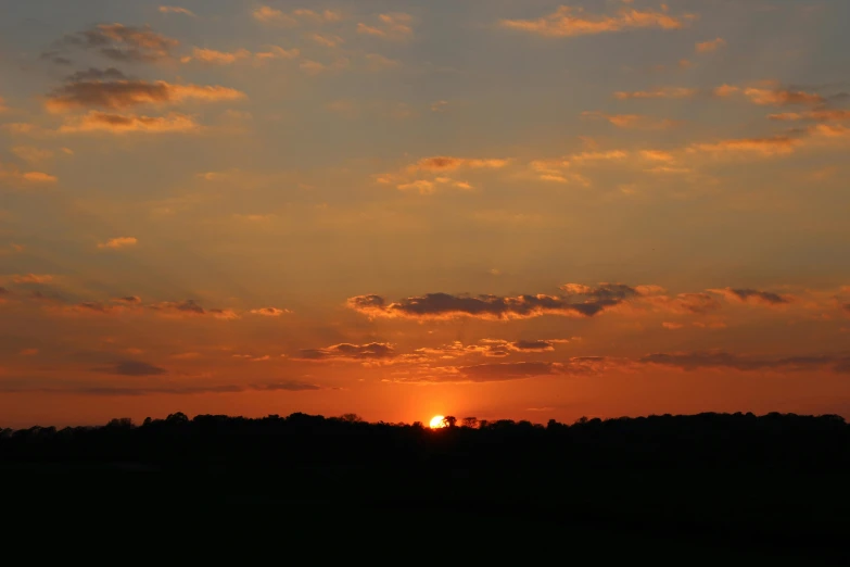 the sun is setting behind the clouds in the sky, a picture, midwest countryside, golden hour photograph, uploaded, ((sunset))