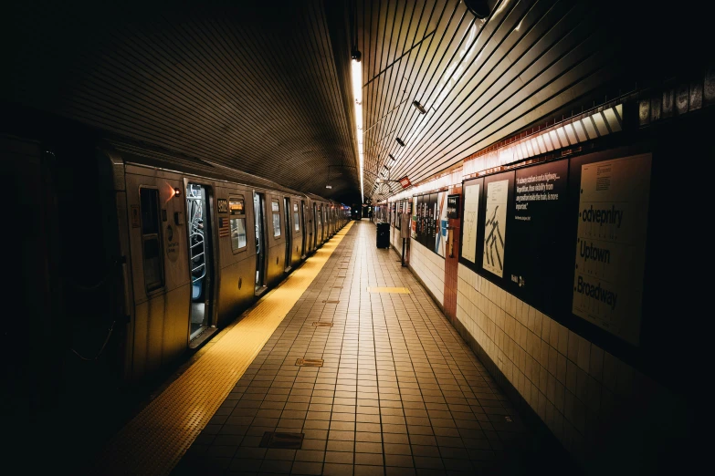 a subway train pulling into a station at night, inspired by Elsa Bleda, unsplash contest winner, manhattan, square lines, 2000s photo, fan favorite