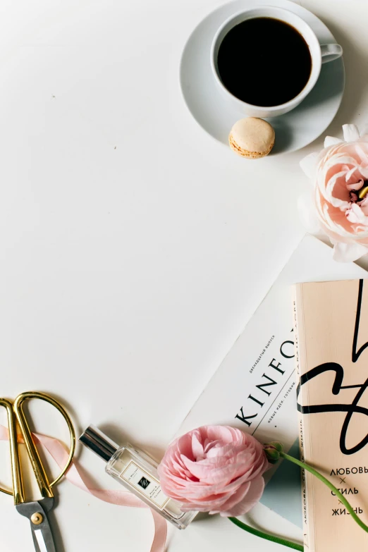 a book sitting on top of a table next to a cup of coffee, a picture, trending on unsplash, minimalism, flowers and gold, design on a white background, clippings of a fashion magazine, product introduction photo