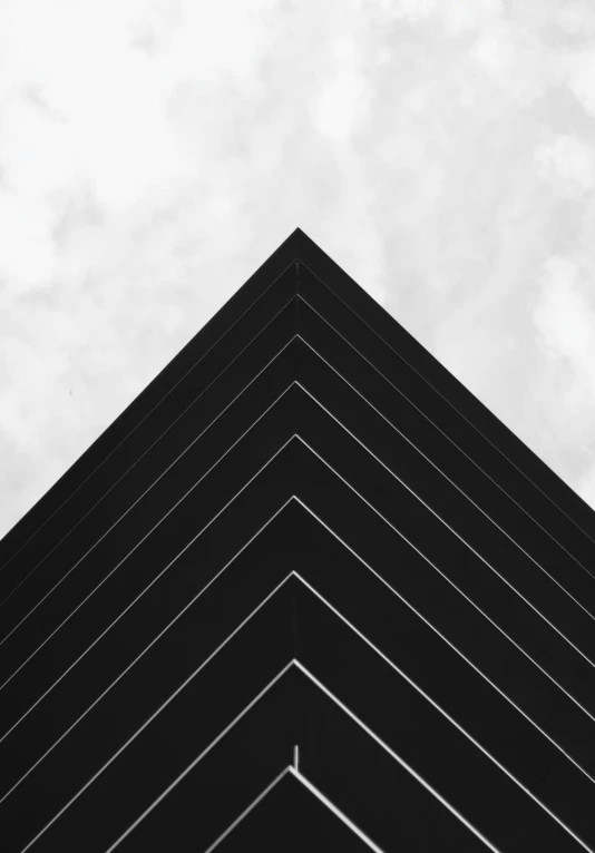 a black and white photo of a building, by Pamphilus, unsplash contest winner, postminimalism, in triangular formation, square lines, crisp lines and color, pyramid