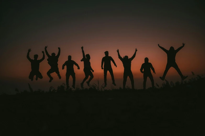 a group of people jumping in the air, by Matija Jama, pexels contest winner, character silhouette, background image, friendship, aaaaaaaaaaaaaaaaaaaaaa