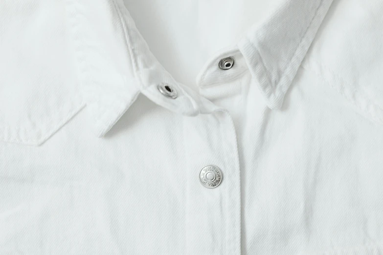 a close up of a white shirt with buttons, silver details, denim, titanium white, white finish