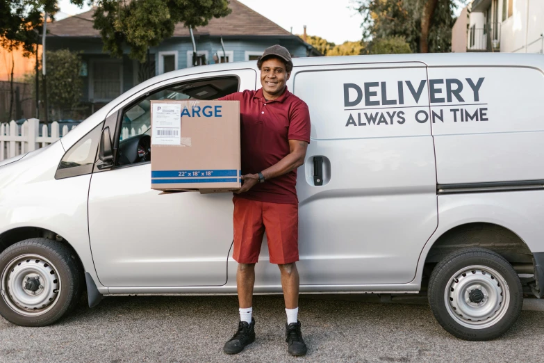 a delivery man holding a box in front of a van, a portrait, by Carey Morris, pexels contest winner, renaissance, avant designer uniform, avatar image, aboriginal, full body photo of steve