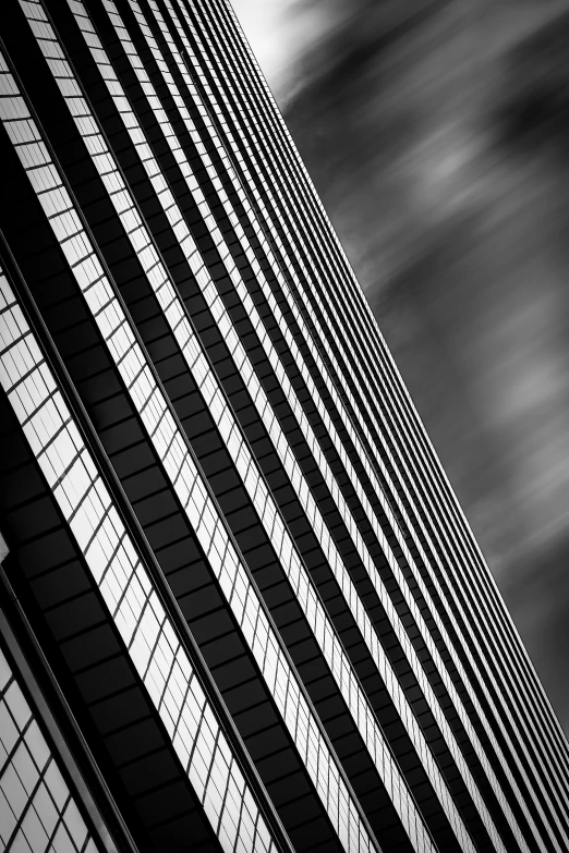 a black and white photo of a tall building, a black and white photo, by Andrew Domachowski, dynamic lines, square, focus stacked, crisp lines and color