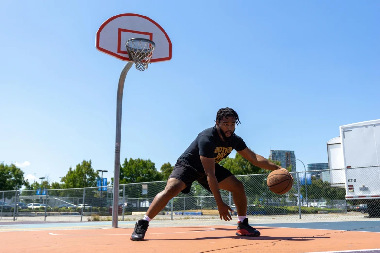 a man standing on top of a basketball court holding a basketball, dribble, sydney park, mid action swing, profile pic, square