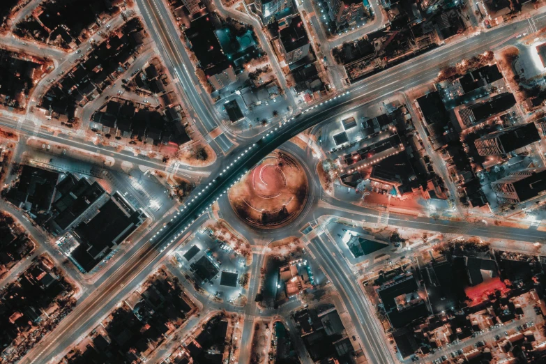 an aerial view of a city at night, by Adam Marczyński, square, circural, switch, thumbnail