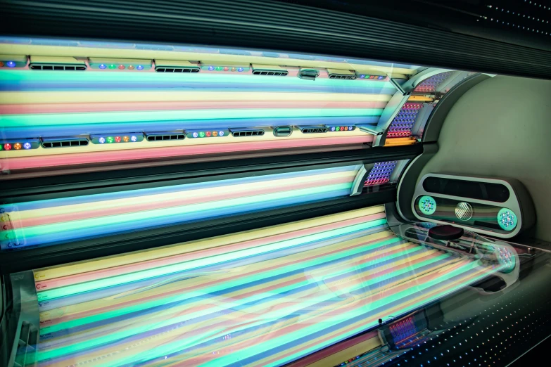 a close up of a tanning bed in a room, pixabay, process art, full colour spectrum, xerography, heated coils, bright signage