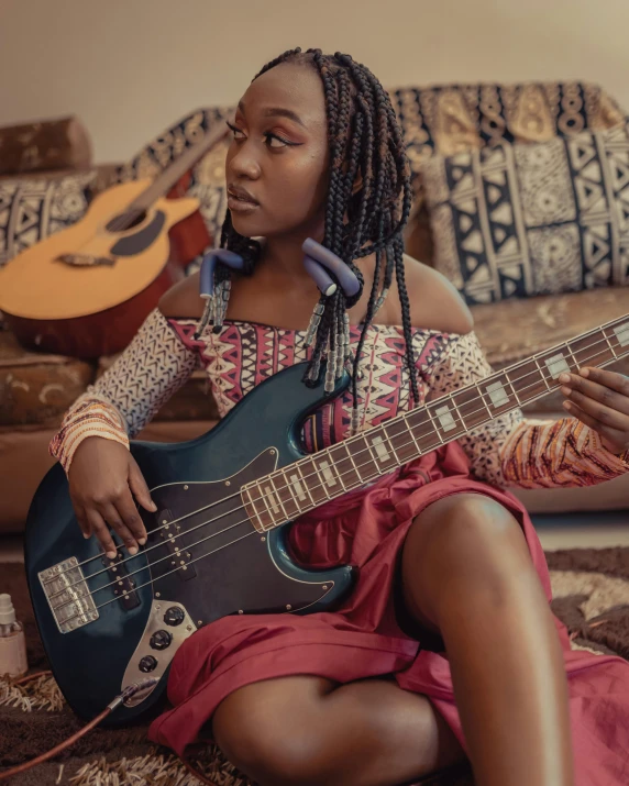 a woman sitting on a couch holding a guitar, trending on pexels, afrofuturism, double bass, black teenage girl, slight overcast, wires and strings