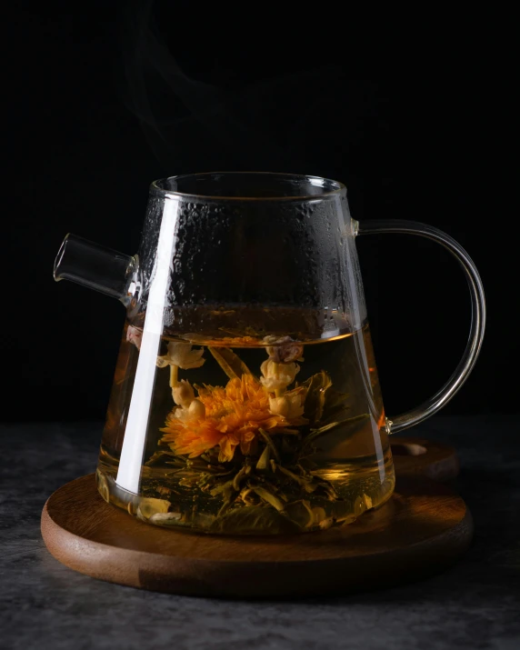 a glass tea pot filled with green and yellow flowers, inspired by Ma Yuan, unsplash, dramatic product lighting, square, grey, drink