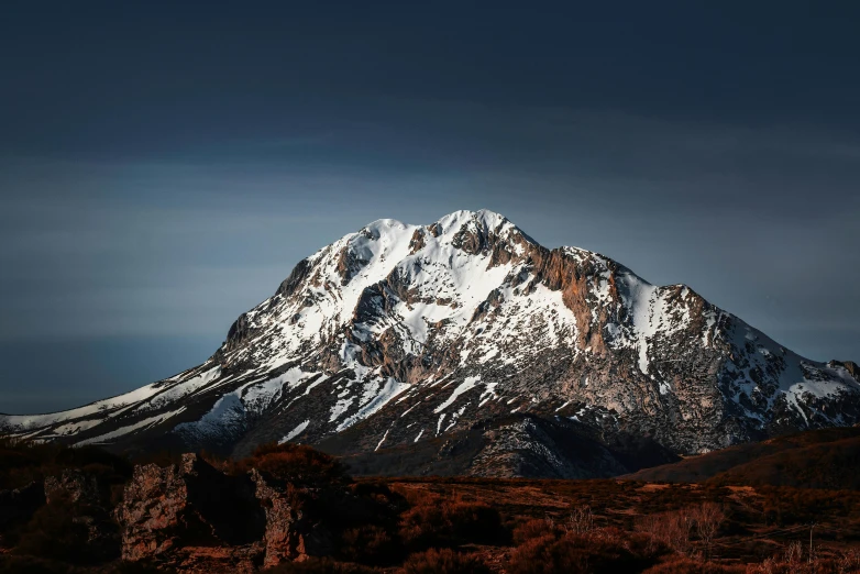 a snowy mountain with no people near it