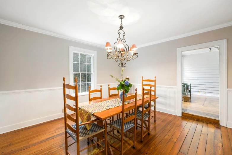 a well lit dining room has a chandelier