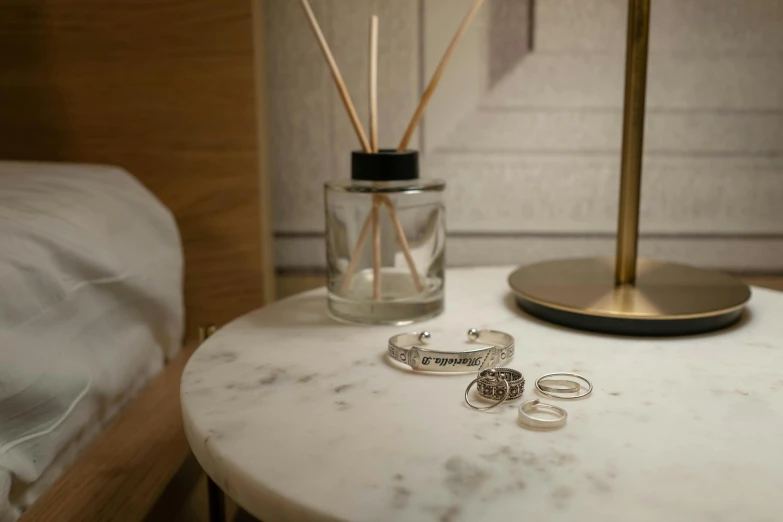 there are two pairs of earrings that is sitting on a table