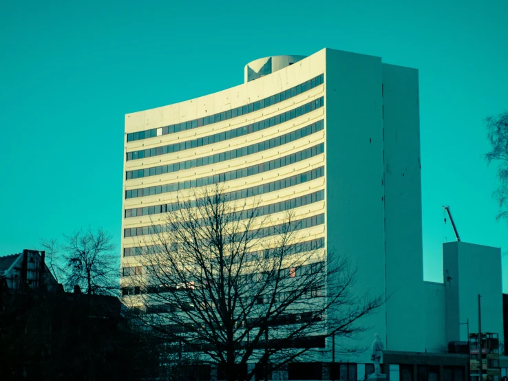 a large building with a very tall building next to it