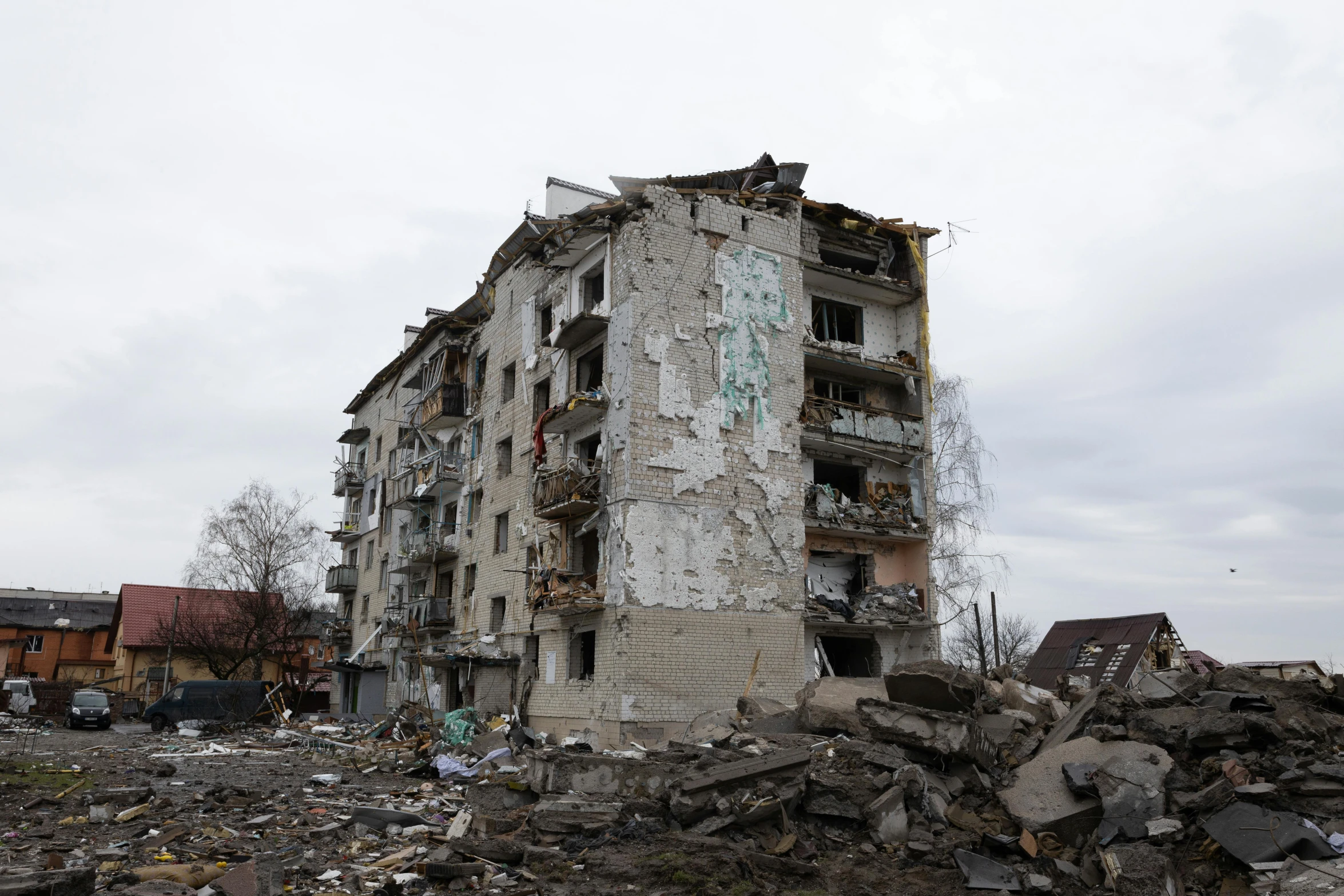 a large building sitting on top of a pile of rubble, a photo, by Adam Marczyński, damaged, 000 — википедия, unedited, white