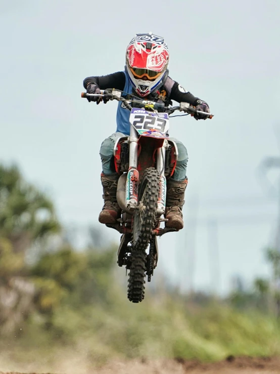 person jumping off the back of a motorcycle in the air