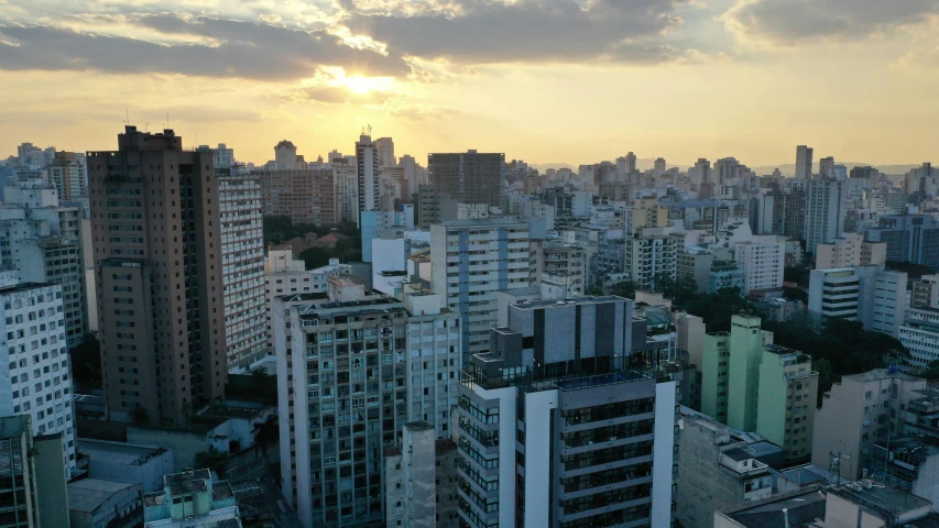 a view of a city from a high rise building, a picture, by Felipe Seade, pexels contest winner, brutalism, brazilian, golden hour 8k, subtitles, full frame image