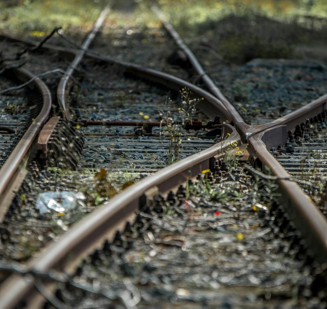 a couple of train tracks sitting next to each other, pexels contest winner, realism, cracked steel, electrical arcs, flattened, high quality photo