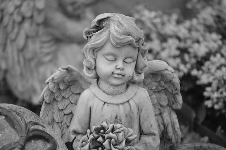 a statue of an angel holding a pine cone, a statue, by Marie Angel, pexels, black and white color only, innocent face, flowers, bashful expression