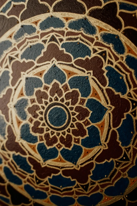 a close up of a decorative object on a table, instagram, cloisonnism, prussian blue and raw sienna, bangkok, mandala, brown