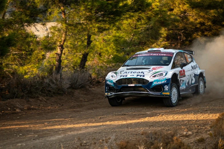 a ford racing car going on a dirt road