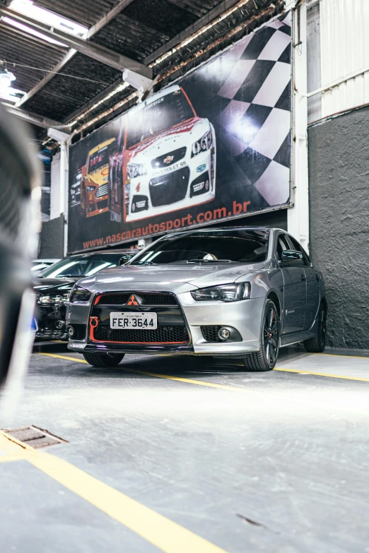 a row of cars parked inside a building