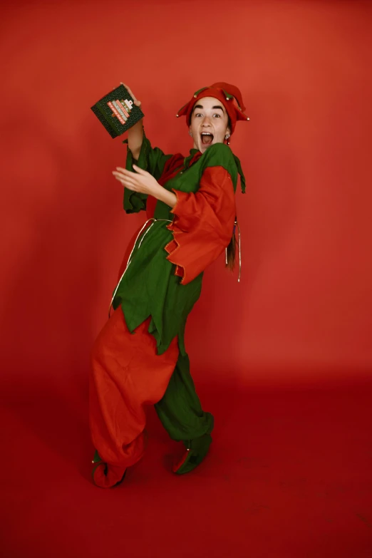 a woman dressed in an orange and green outfit
